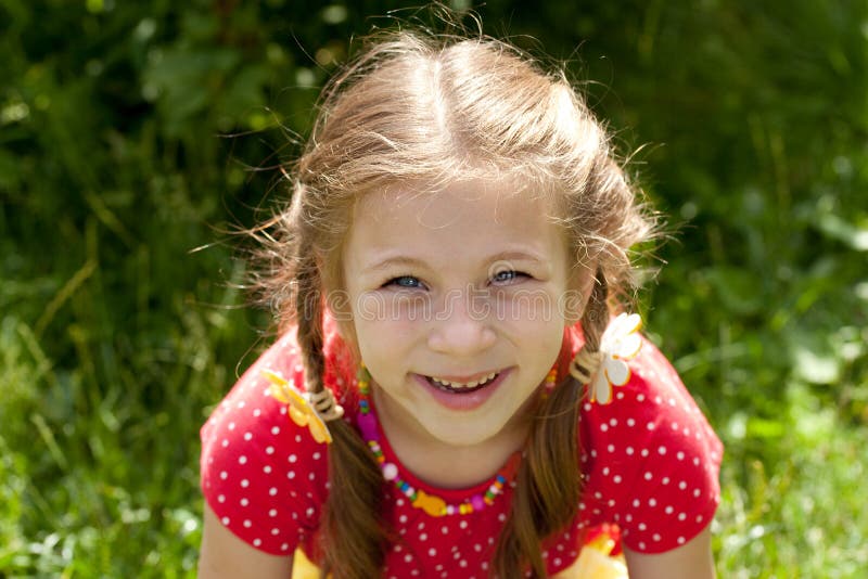 Portrait of laughing girl with pigtails