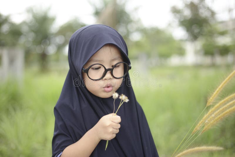 Little Asian Muslim Girl Playing in the Park stock images Little Asian Muslim Girl Playing in the Park stock images