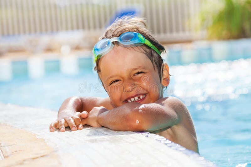 Portrait of little boy having fun in swimming pool