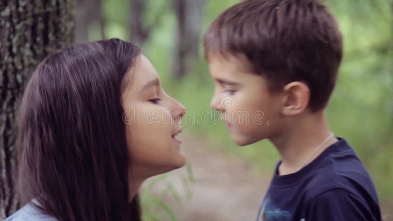 Portrait. a Little Boy is Kissing with a Little Girl and Hugging Loving Hard Each Other. Slow Motion Stock Video - Video of beauty, attitudes: 97471383 