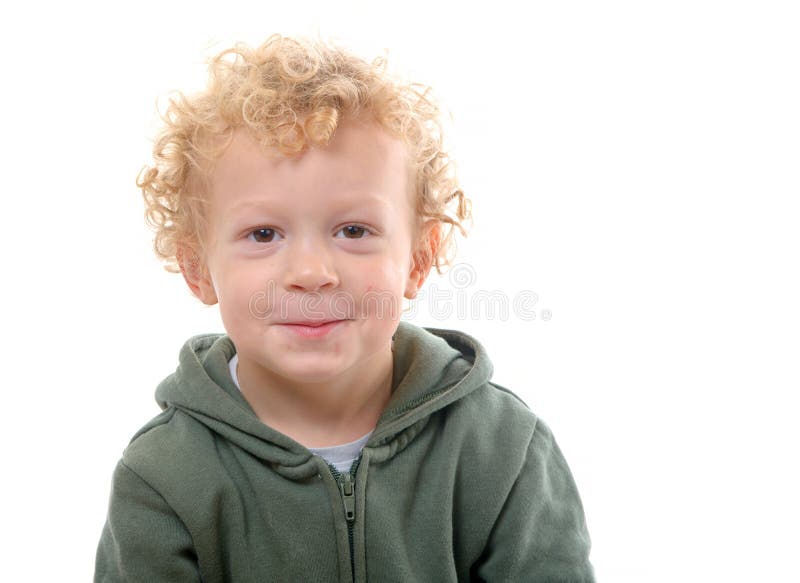 Portrait of a little boy of 3 years with a green coat