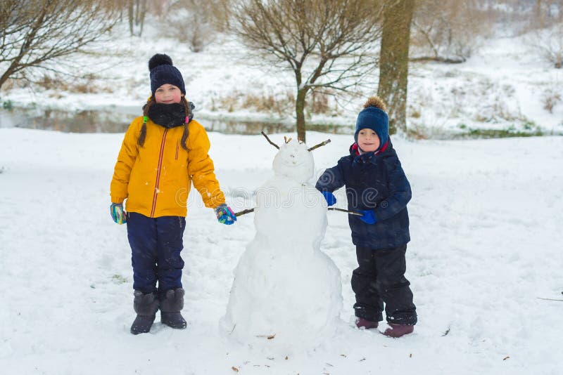 Portrait of little brother and sister. children play in the winter. stock images Portrait of little brother and sister. children play in the winter. stock images