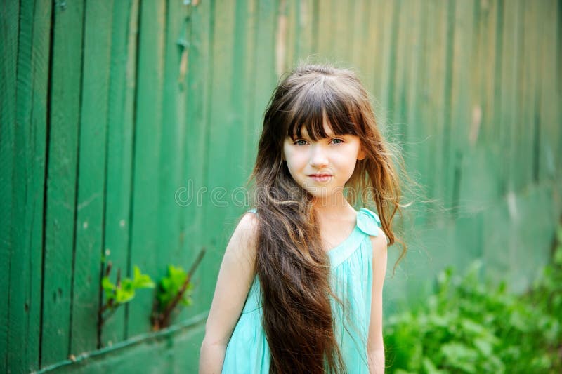 Portrait of little child girl with long hair