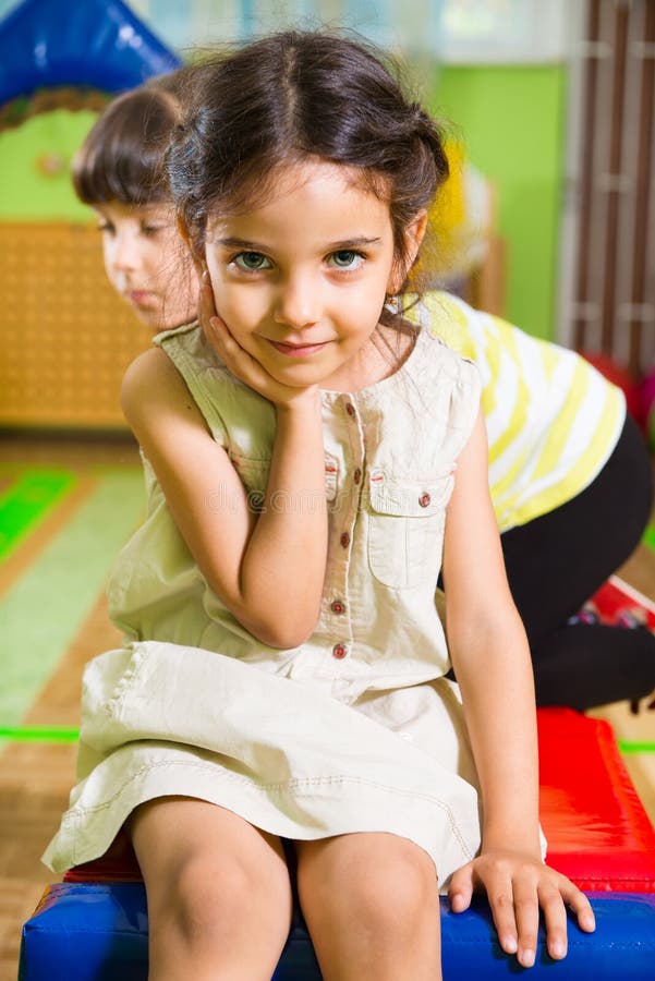 Portrait of little cute latin girl in daycare stock photos