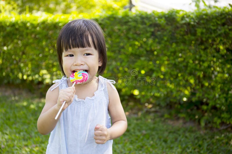 Portrait of a little girl with lollipop royalty free stock photo