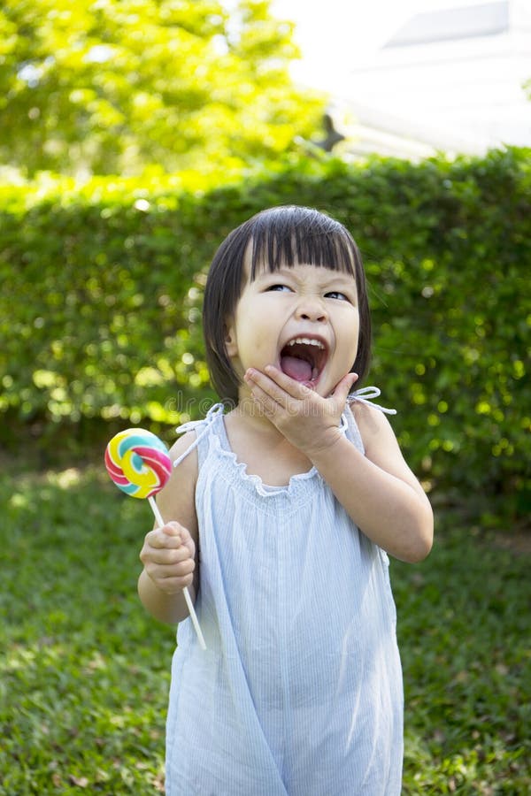 Portrait of a little girl with lollipop royalty free stock photo