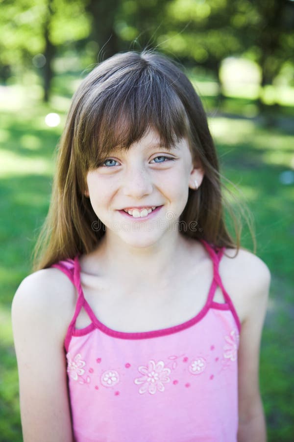 Portrait of little girl playing in the park