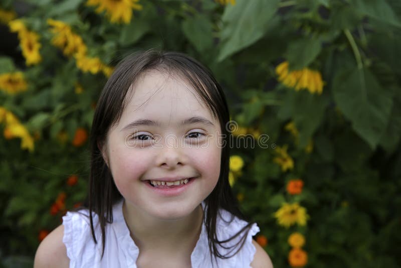 Portrait of little girl smiling in the garden stock image Portrait of little girl smiling in the garden stock image