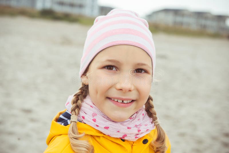 Portrait of Little Girl in Yellow Jacket on Beach at Cloud Rainy ...