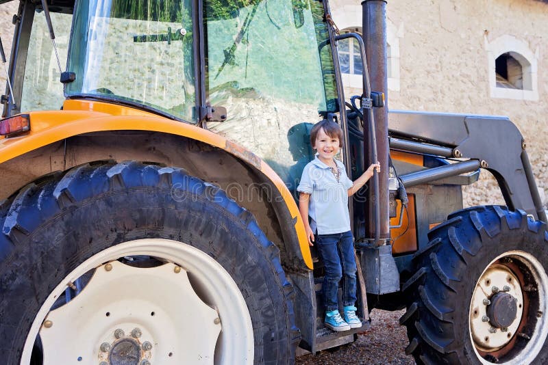 Portrait of Little Smiling Boy in Tractor in Summe Stock Photo Image