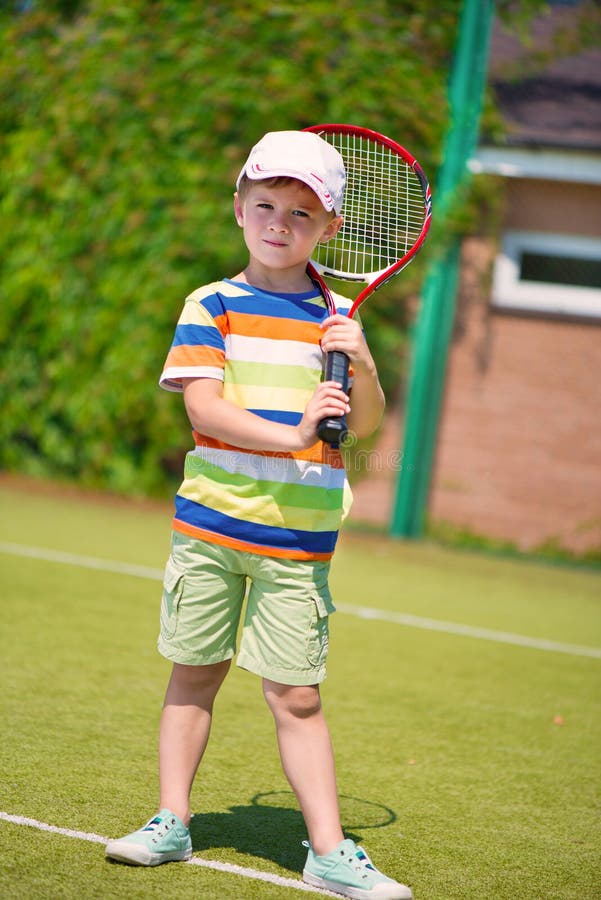 young boy tennis player Stock Photo | Adobe Stock