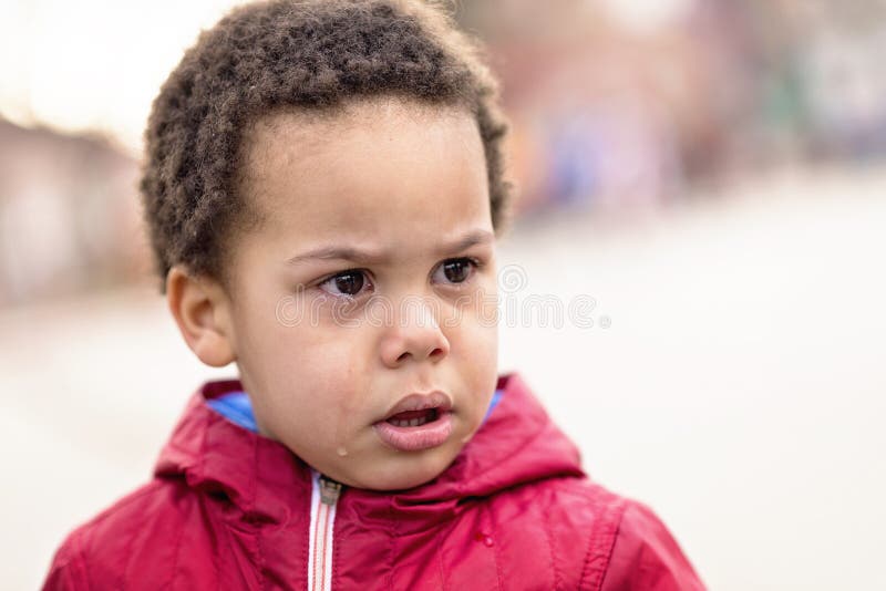 Portrait of a little upset scared toddler boy crying