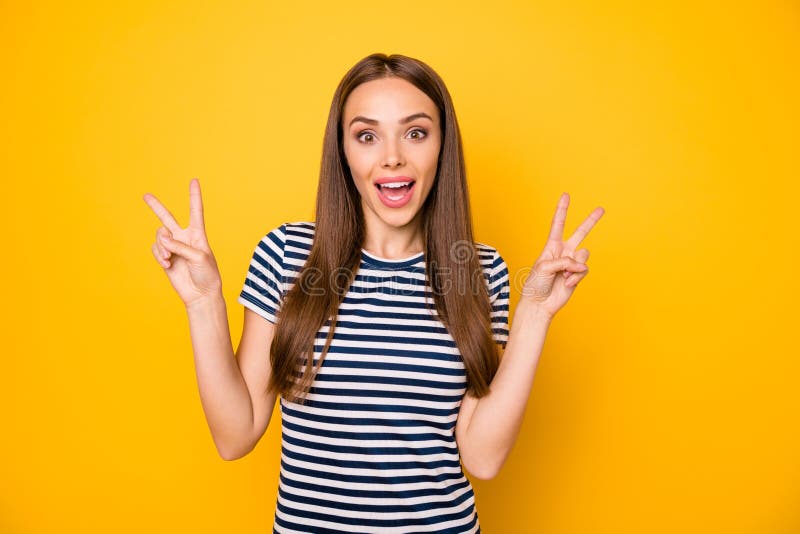 Portrait of Lovely Teenager Making V-signs Screaming Over Yellow ...