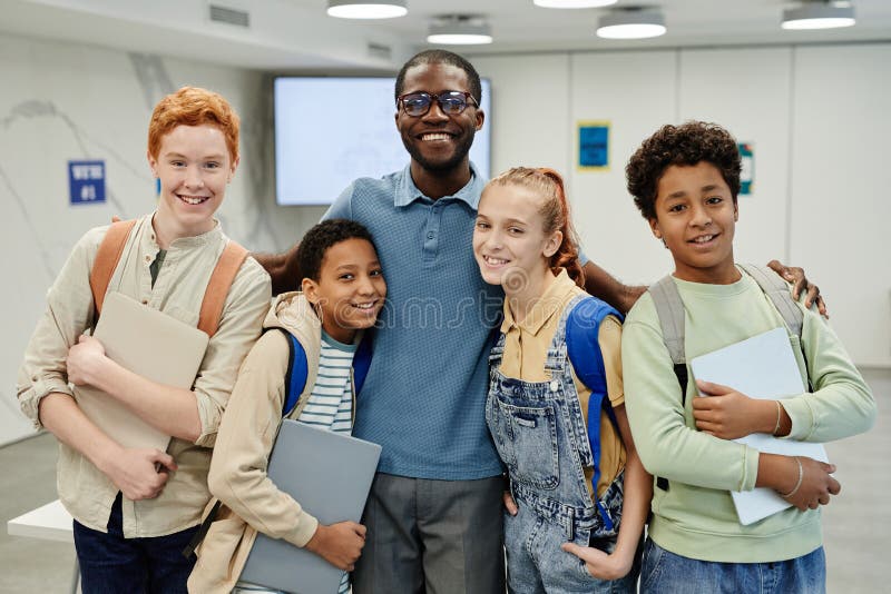 Kids Embracing Teacher royalty free stock photo