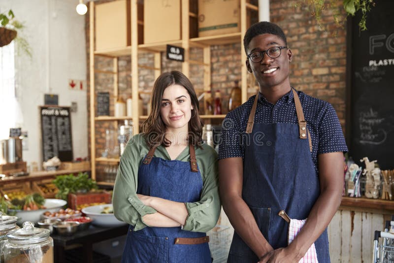 Portrait Of Male And Female Owners Of Sustainable Plastic Free Grocery Store stock photo Portrait Of Male And Female Owners Of Sustainable Plastic Free Grocery Store stock photo
