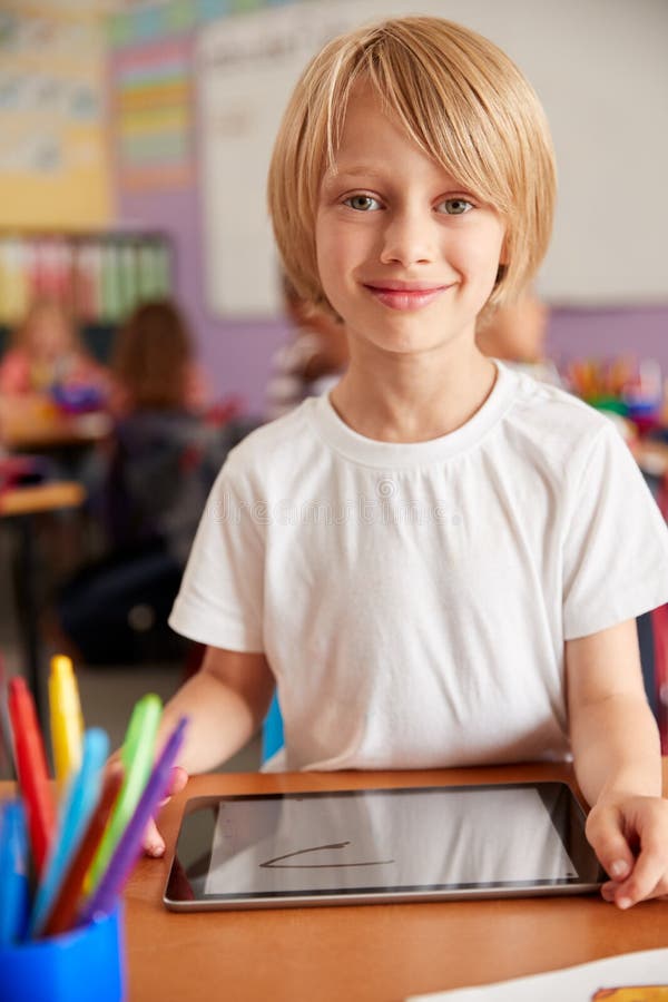 Portrait of Male Pupil in Elementary School Drawing Using Digital