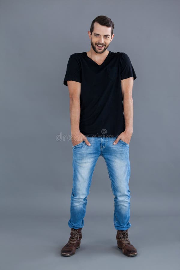 Portrait Of A Man In Black T-shirt And Blue Jeans Stock Photo - Image ...