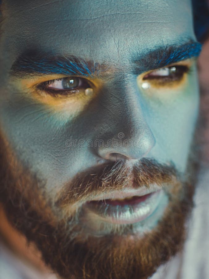 Portrait of a Man with a Blue Make-up on His Face. Stage Make-up, Like ...