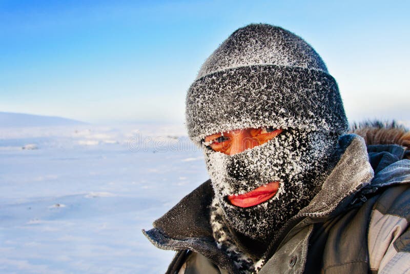 Portrait Of A Man In A Cap And A Ski Mask. Stock Photo - Image of