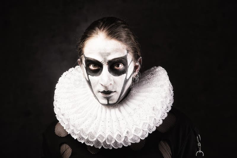Portrait of man in goth style clothes and ruff collar.