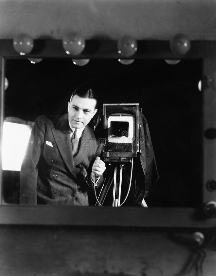 Portrait of a man standing with a large format camera. (All persons depicted are no longer living and no estate exists. Supplier grants that there will be no stock image Portrait of a man standing with a large format camera. (All persons depicted are no longer living and no estate exists. Supplier grants that there will be no stock image