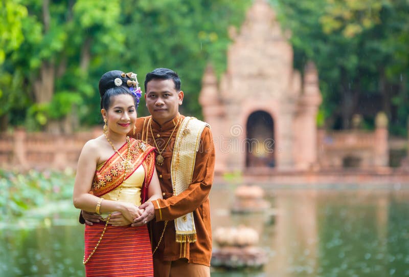 Portrait of men and women in traditional clothes of the north of Thailand.