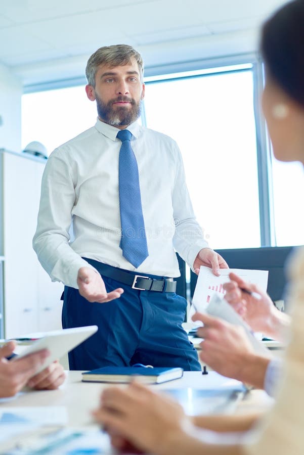 Mature Boss Briefing Employees in Meeting Stock Photo - Image of ...