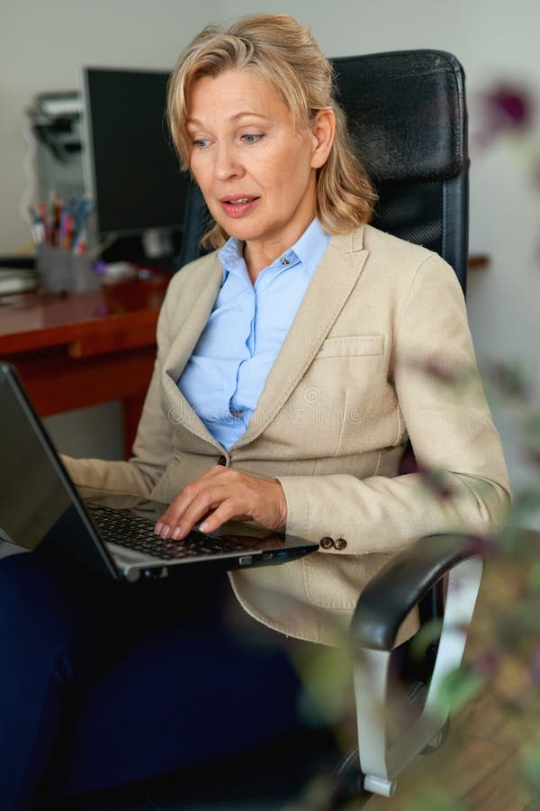 Portrait Mature Female Boss Working in Office Stock Image of leader, modern: