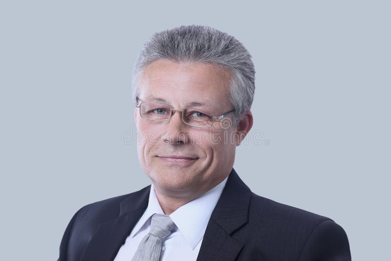 Portrait of a mature gray-haired business man isolated on gray