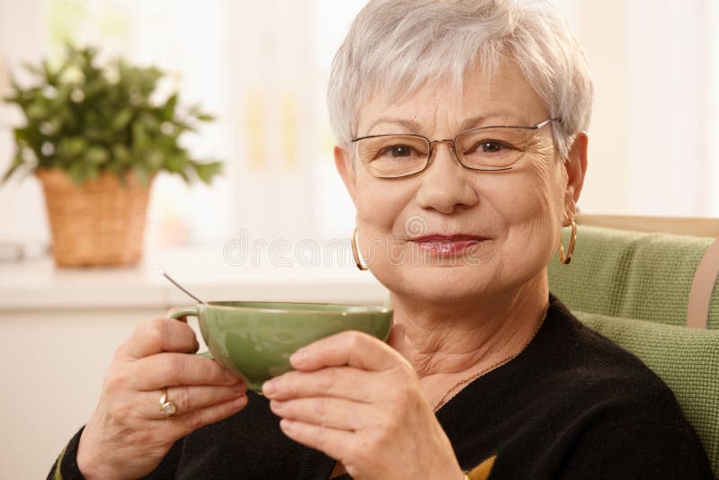 Portrait of mature lady with teacup royalty free stock photos Portrait of mature lady with teacup royalty free stock photos