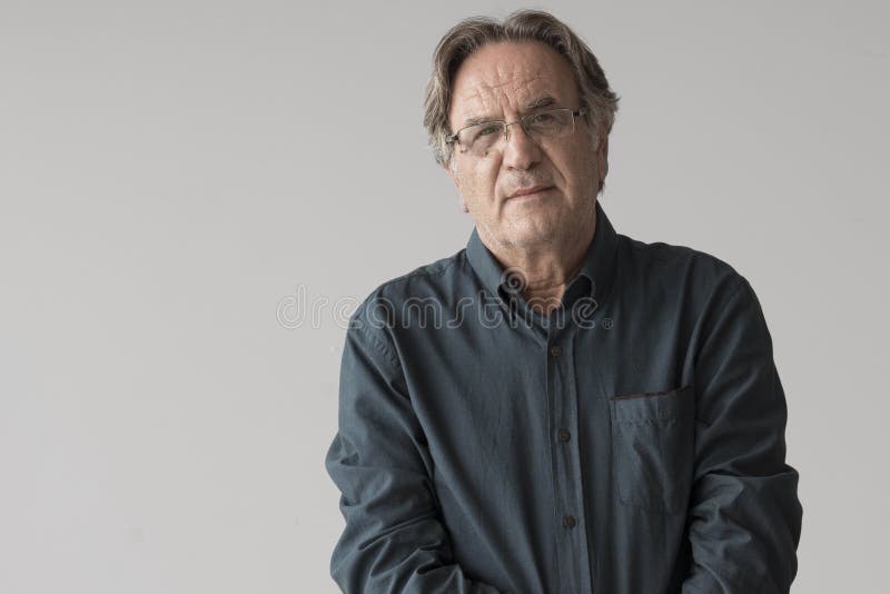 Portrait of mature man on grey background stock photo