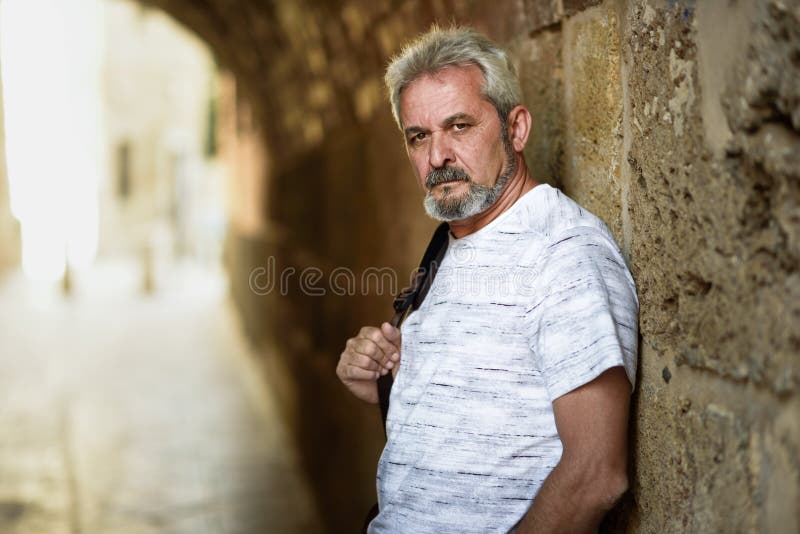 Portrait of a mature serious man in urban background. stock images Portrait of a mature serious man in urban background. stock images