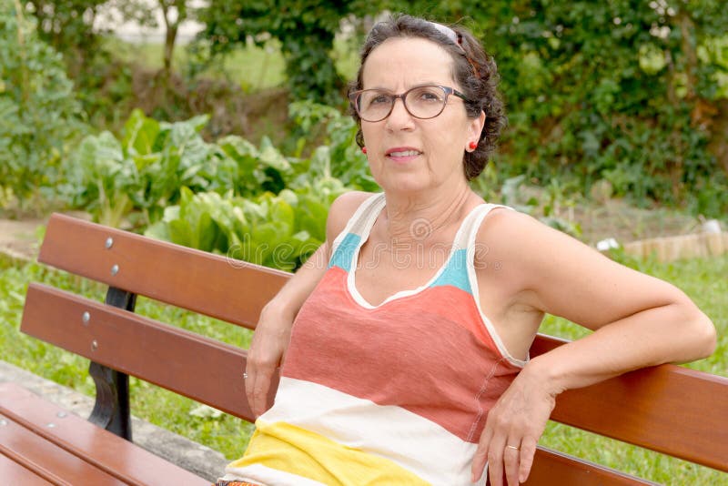 Portrait Of A Middle Aged Brunette Woman With Eyeglasses Outdoor Stock