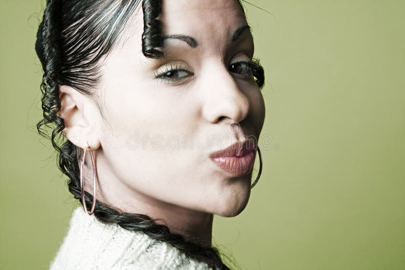 Portrait of Middle Eastern Woman lips puckered in royalty free stock image Portrait of Middle Eastern Woman lips puckered in royalty free stock image