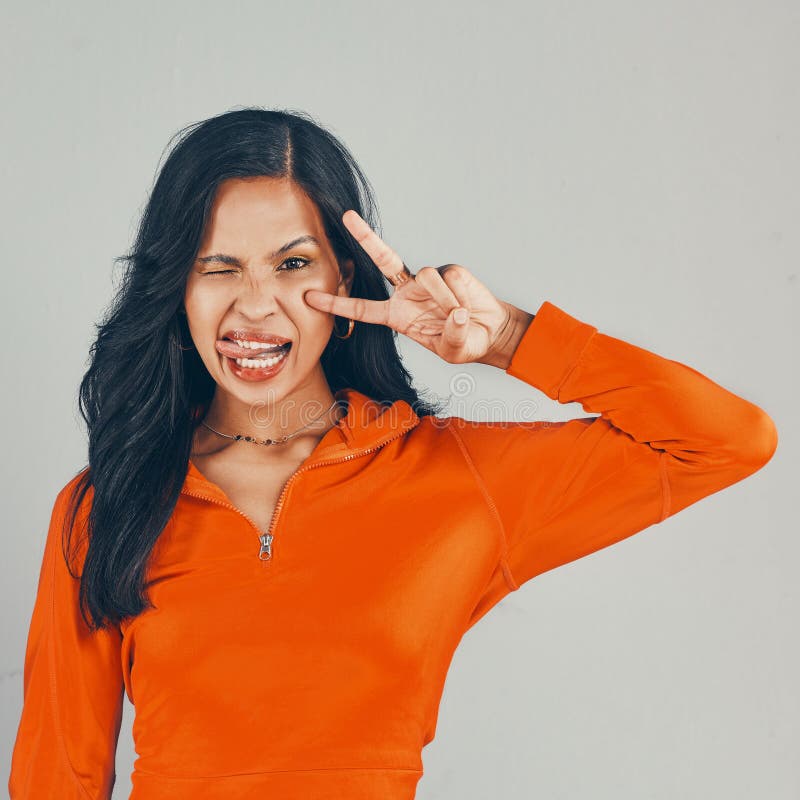 Portrait of Mixed Race Woman Isolated Against Grey Studio Background