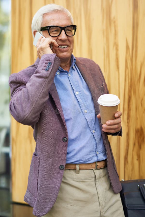Contemporary Senior Man Speaking by Phone royalty free stock images Contemporary Senior Man Speaking by Phone royalty free stock images