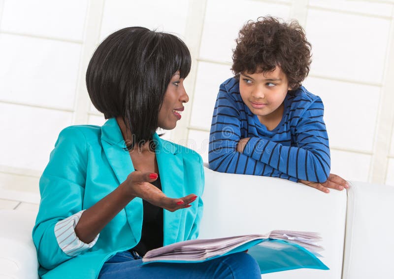 Portrait Of Mom Helping Son With Homework Stock Photo Image Of Y