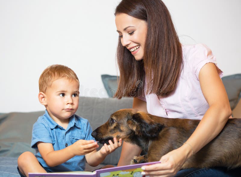 Mom and baby with pet dog. royalty free stock photography Mom and baby with pet dog. royalty free stock photography