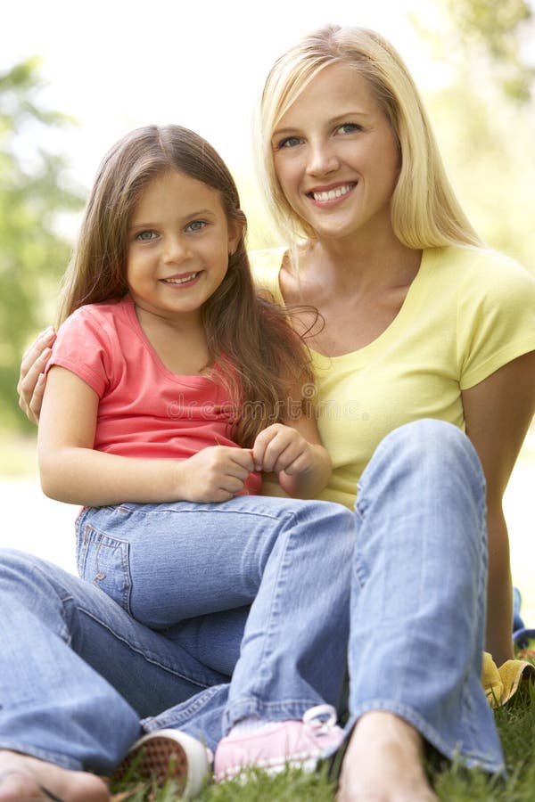 Portrait Of Mother And Daughter In Park stock photo Portrait Of Mother And Daughter In Park stock photo