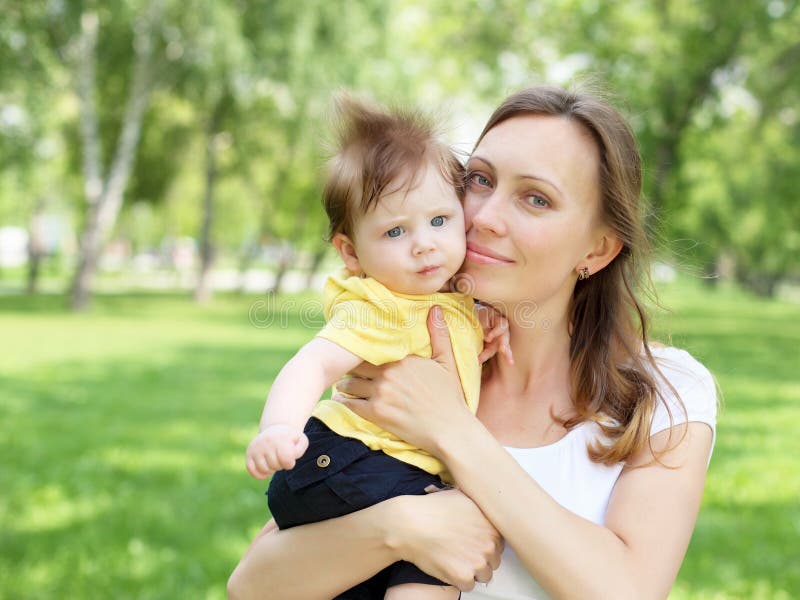 Portrait of mother holding her little baby