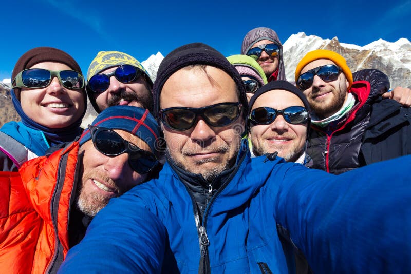 Portrait of Mountain Climbers Team happy to reach the Summit royalty free stock image Portrait of Mountain Climbers Team happy to reach the Summit royalty free stock image