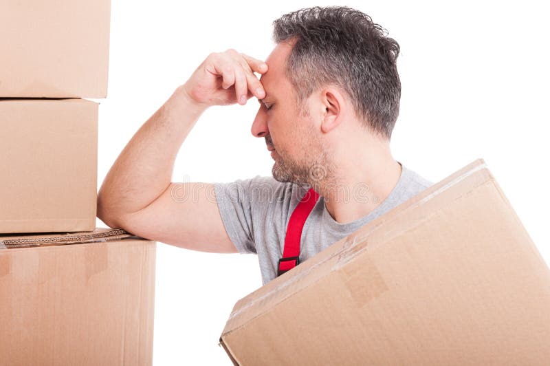 Portrait of mover holding box and looking tired or sick royalty free stock photo