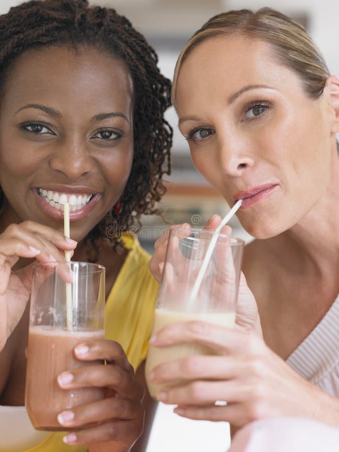 Portrait Of Multiethnic Women Drinking Milkshake