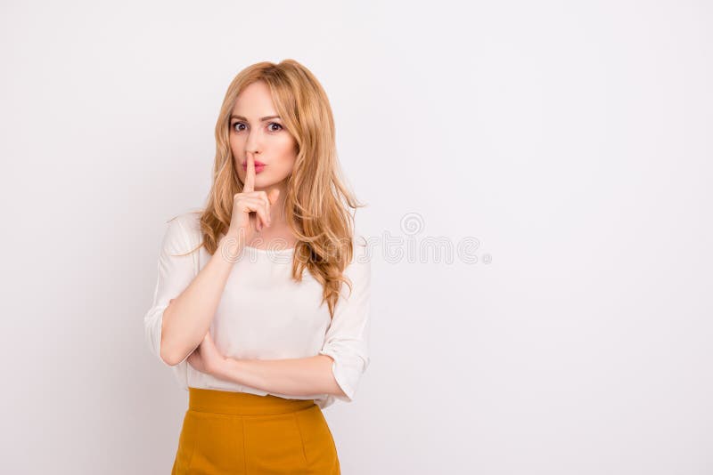 Portrait of mysterious businesswoman gesturing `shh!` against white background isolated on white background copy-space whisper s stock photo Portrait of mysterious businesswoman gesturing `shh!` against white background isolated on white background copy-space whisper s stock photo