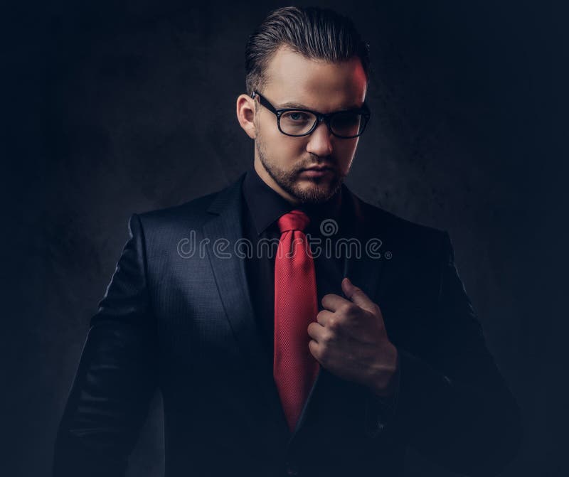 Portrait of a Mystical Stylish Male in a Black Suit and Red Tie ...