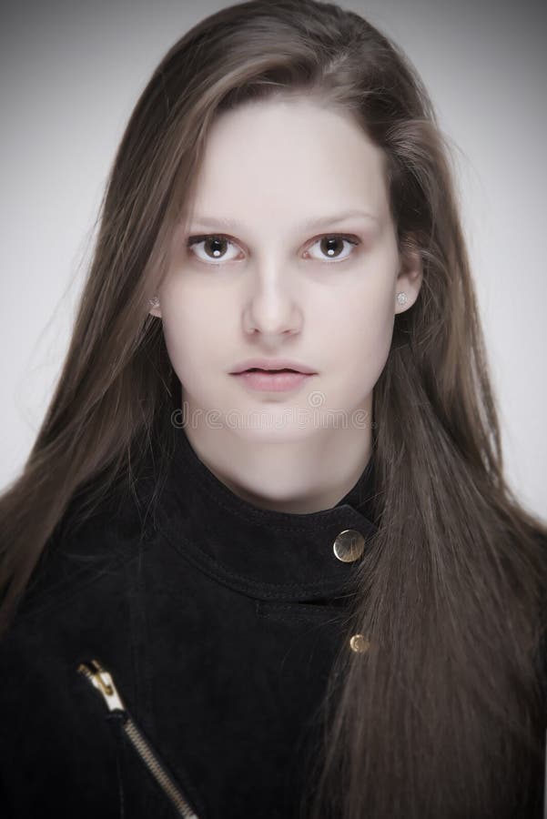 Portrait of natural beauty girl with gorgeous long hair and piercing eyes