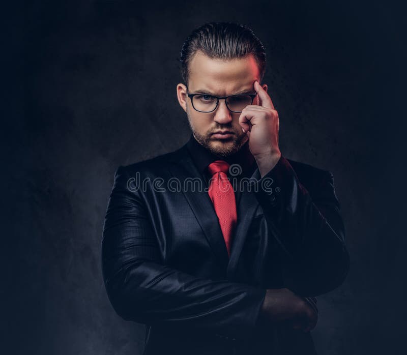 Portrait of a Pensive Stylish Male in a Black Suit and Red Tie. Stock ...