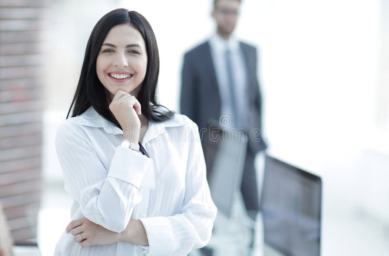 Perspective successful young woman in the office