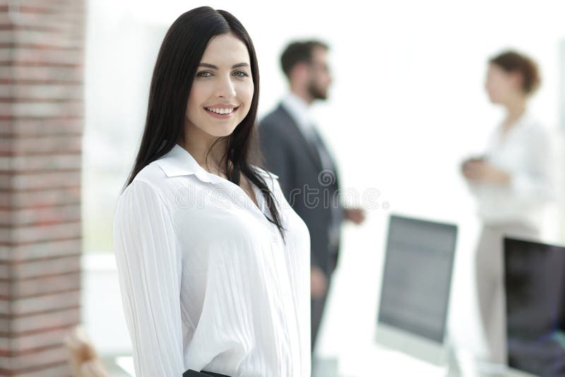 Perspective successful young woman in the office