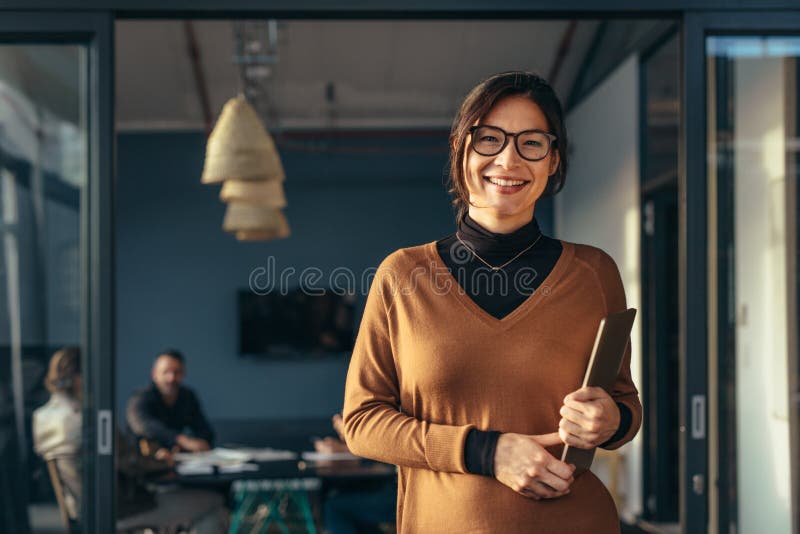 Smiling business woman in casuals at office